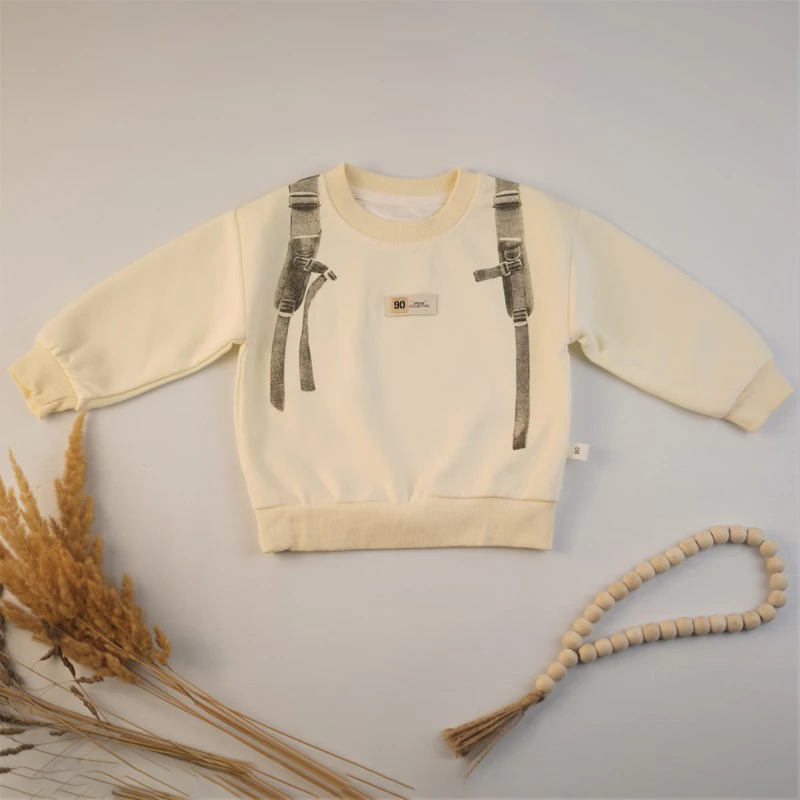 بلوز پسرانه طرح کوله رنگ کرم