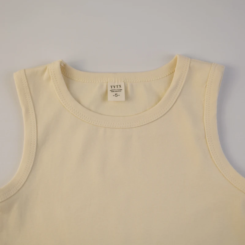 بلوز دخترانه دو لایه با بندهای تزئینی و لوگوی MIU MIU