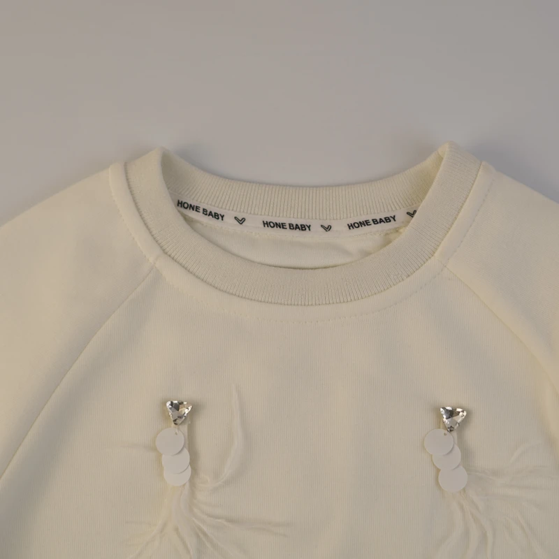 بلوز دخترانه کرم با پر و مروارید